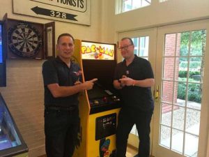 Michael George and Richard Tubb playing Pac-Man